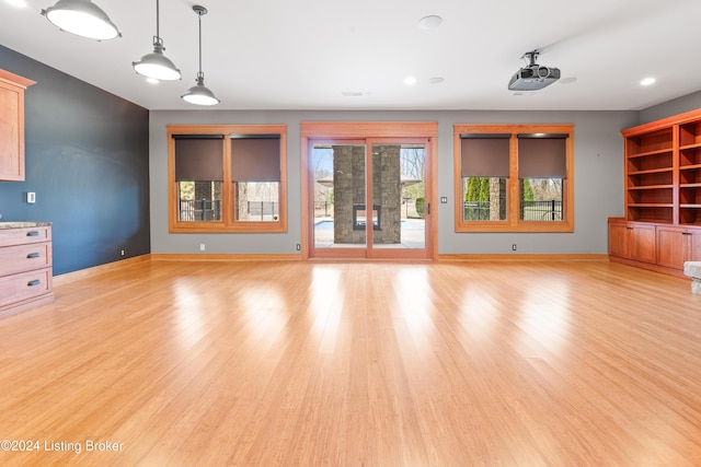 unfurnished living room with light wood-type flooring