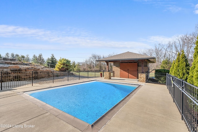 view of pool featuring a patio