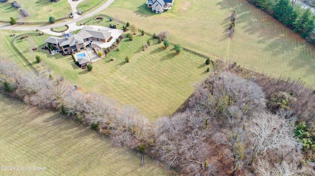 birds eye view of property with a rural view