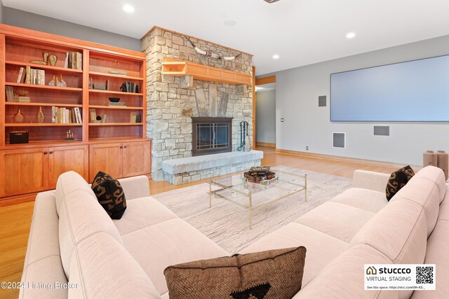 living room featuring a fireplace and light hardwood / wood-style floors