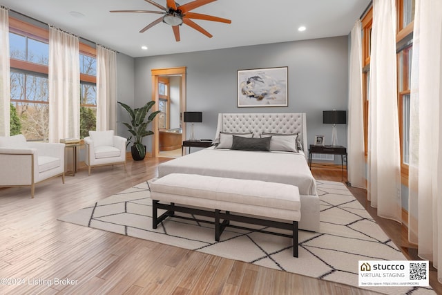 bedroom featuring ceiling fan and light hardwood / wood-style flooring