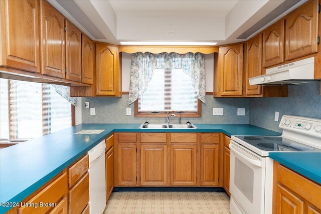 kitchen featuring white appliances and sink