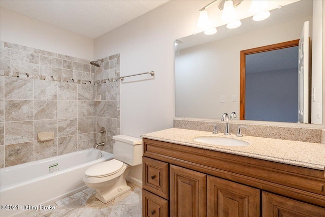 full bathroom featuring vanity, toilet, and tiled shower / bath combo