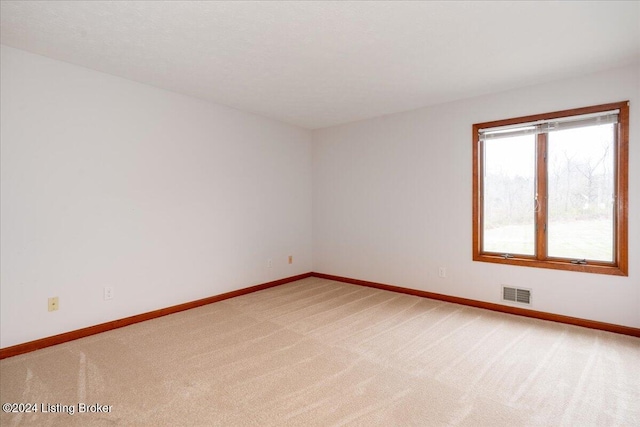 spare room with carpet flooring