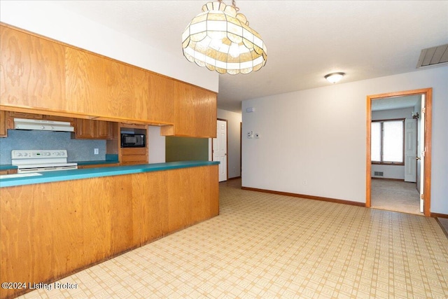 kitchen with range with electric stovetop, black microwave, and hanging light fixtures