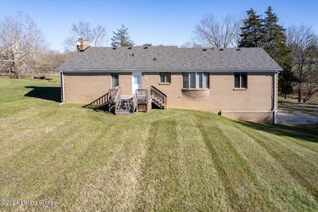 back of house featuring a yard