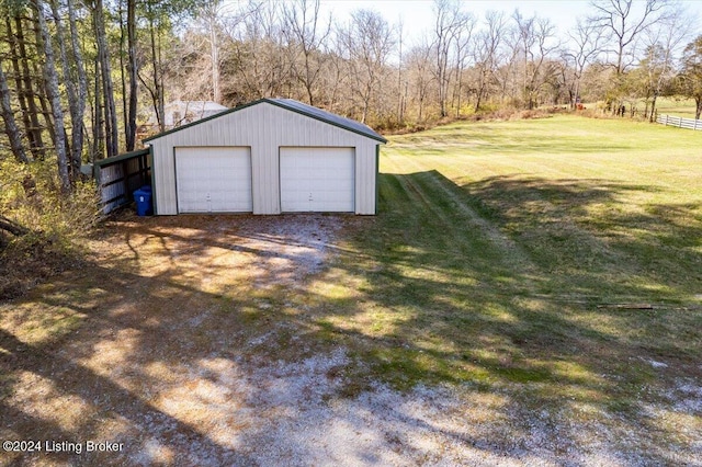 garage featuring a yard