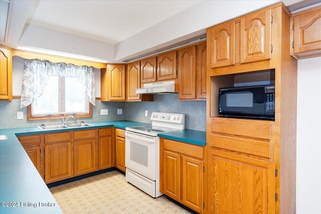 kitchen featuring electric range and sink