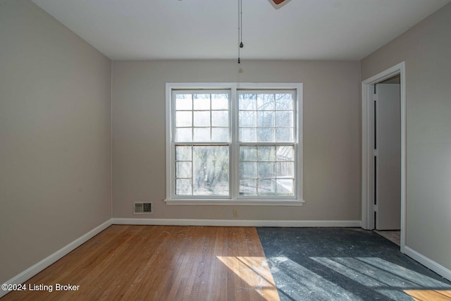 empty room featuring hardwood / wood-style floors