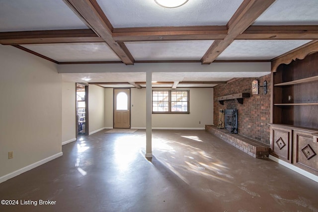 unfurnished living room with beamed ceiling, concrete flooring, and coffered ceiling