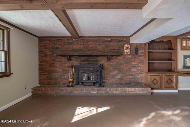 unfurnished living room with a textured ceiling, a wood stove, and ornamental molding