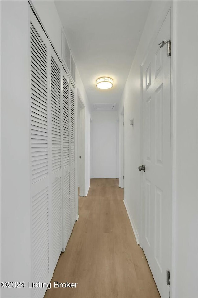 corridor featuring light hardwood / wood-style flooring