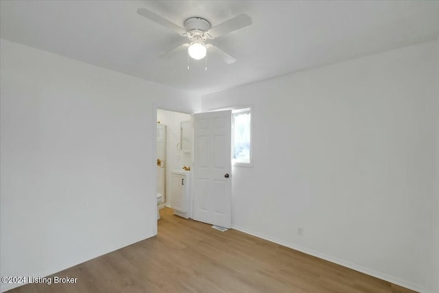 spare room featuring ceiling fan and light hardwood / wood-style flooring