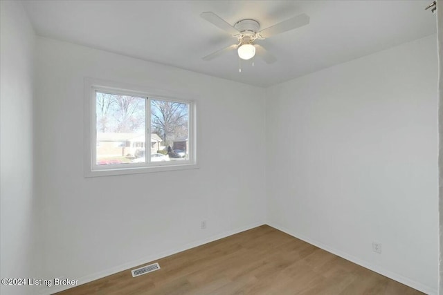 unfurnished room featuring hardwood / wood-style flooring and ceiling fan