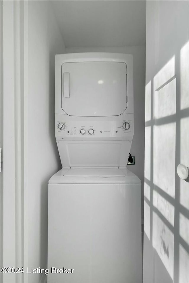 washroom with stacked washer and dryer