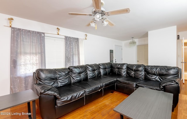 living room with ceiling fan and hardwood / wood-style flooring