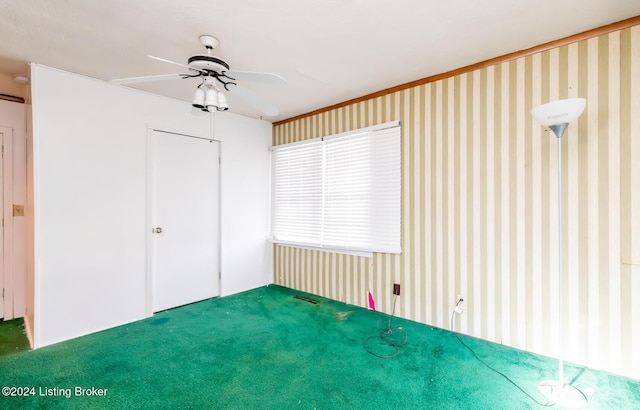 unfurnished bedroom with carpet, a closet, and ceiling fan