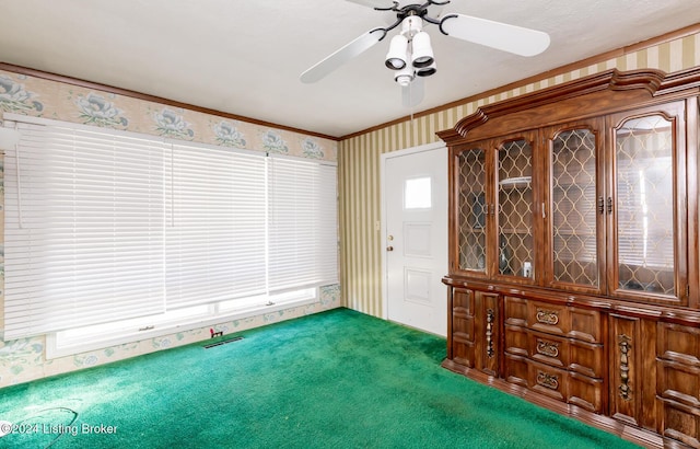 interior space with ceiling fan