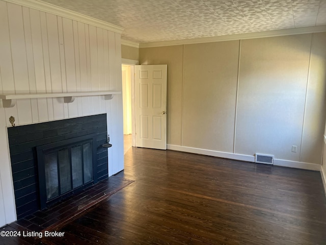 unfurnished living room featuring crown molding and dark wood-type flooring