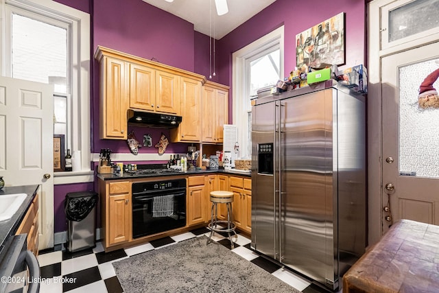 kitchen featuring sink and black appliances