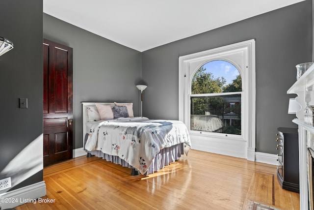 bedroom with wood-type flooring