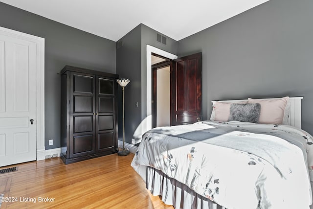 bedroom with light hardwood / wood-style floors