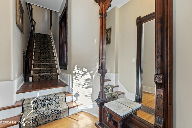 staircase featuring hardwood / wood-style flooring