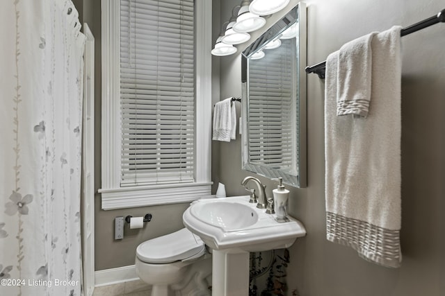 bathroom with tile patterned floors, sink, and toilet