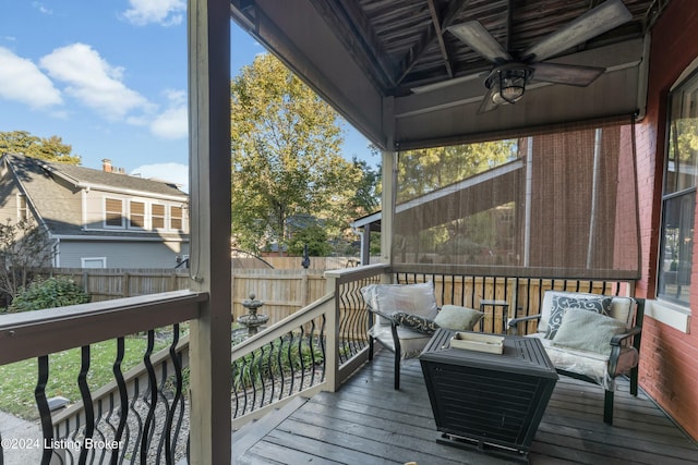 deck with ceiling fan and an outdoor hangout area