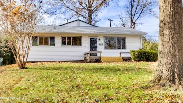 ranch-style home with a front lawn