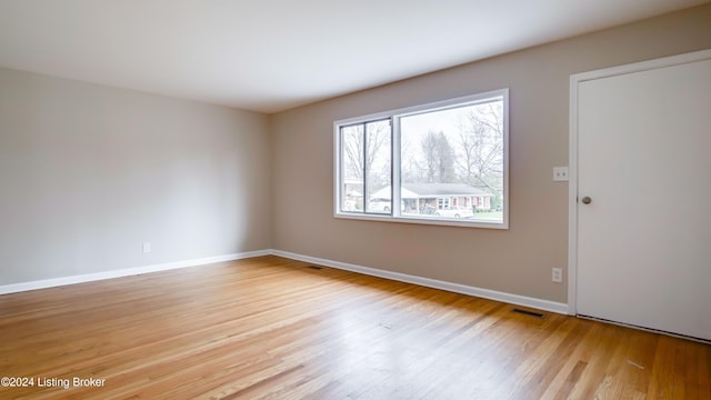 spare room featuring light wood-type flooring