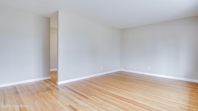 spare room featuring light wood-type flooring