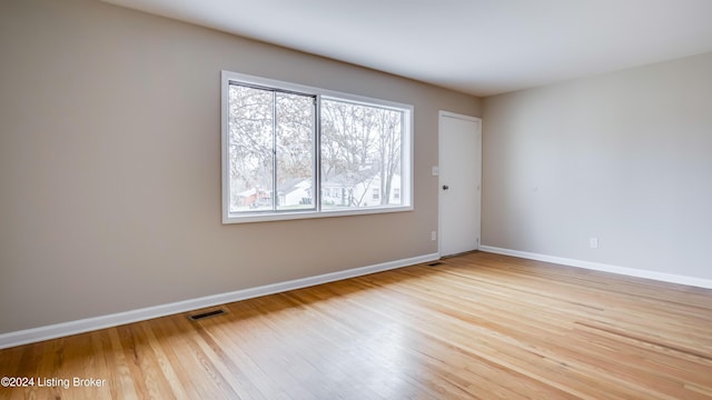 unfurnished room featuring light wood-type flooring