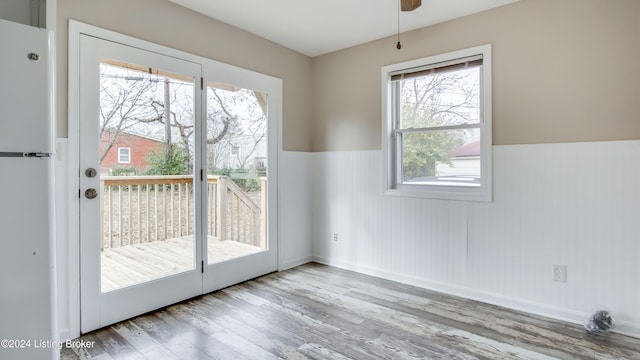 entryway with ceiling fan and light wood-type flooring