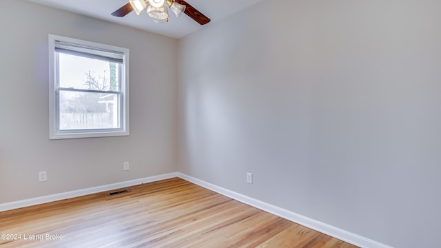 empty room featuring light wood-type flooring and ceiling fan