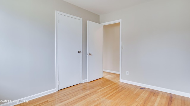 unfurnished room with light hardwood / wood-style flooring