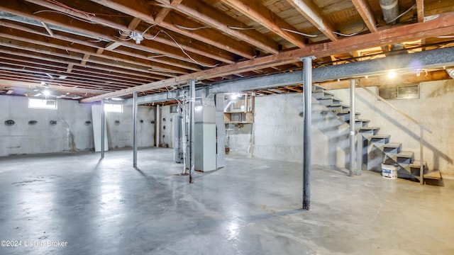 basement featuring gas water heater and heating unit