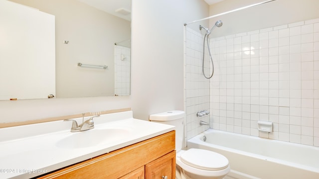 full bathroom with vanity, toilet, and tiled shower / bath