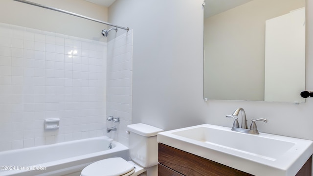 full bathroom featuring vanity, tiled shower / bath combo, and toilet