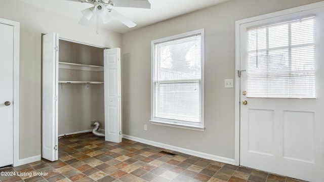 entryway with ceiling fan