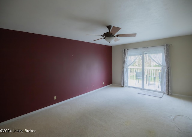 carpeted empty room with ceiling fan