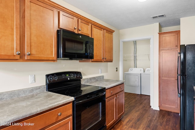 kitchen featuring a textured ceiling, separate washer and dryer, black appliances, and dark hardwood / wood-style floors