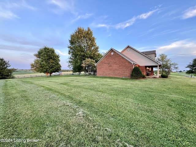 view of yard with a rural view