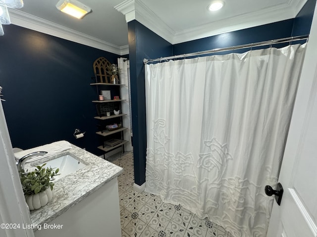 bathroom featuring curtained shower, vanity, and ornamental molding