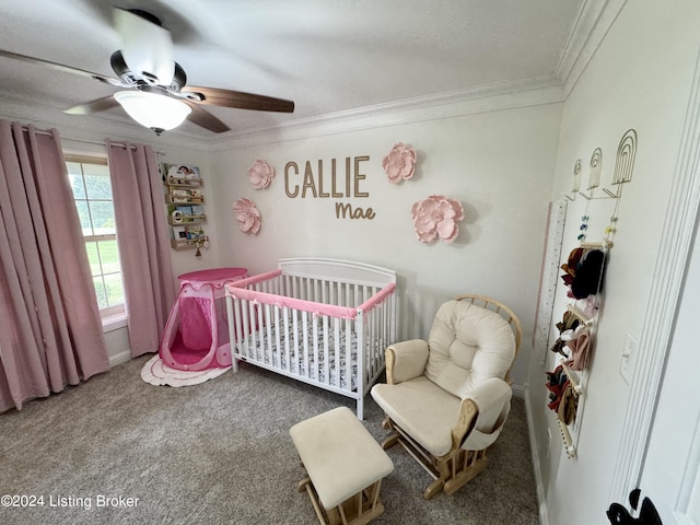 bedroom featuring carpet flooring, ceiling fan, a nursery area, and ornamental molding