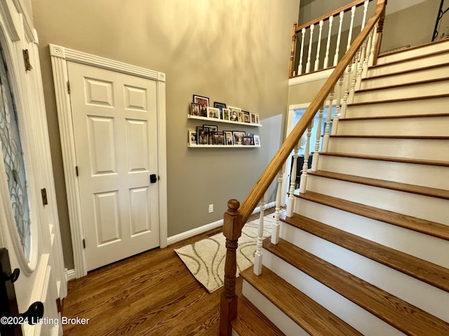 staircase featuring hardwood / wood-style floors