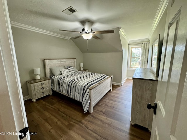 bedroom with lofted ceiling, ceiling fan, dark hardwood / wood-style floors, and ornamental molding