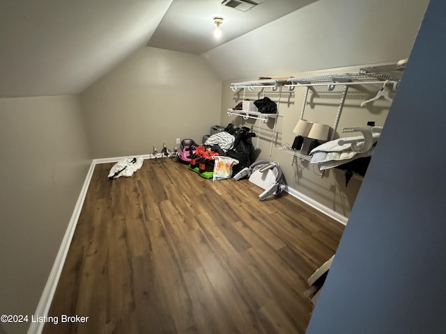 bonus room with hardwood / wood-style floors and lofted ceiling