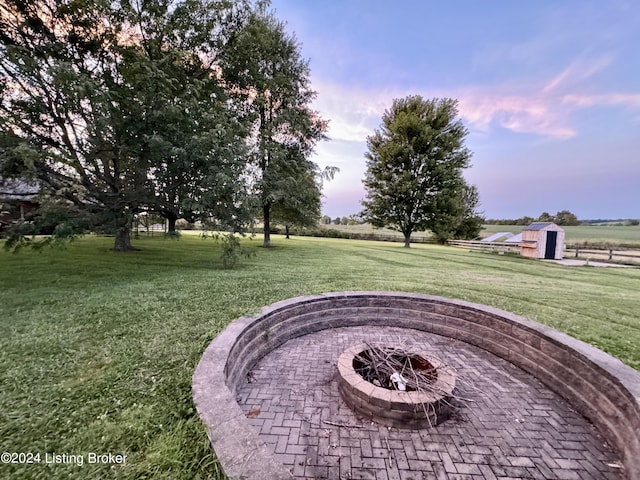 exterior space featuring an outdoor fire pit and a patio area