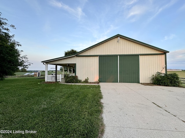 garage featuring a lawn